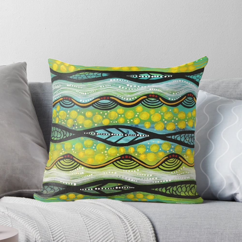 Colorful pillow featuring a Yoongali-designed aboriginal art print of a wattle flower, an iconic Australian native plant.