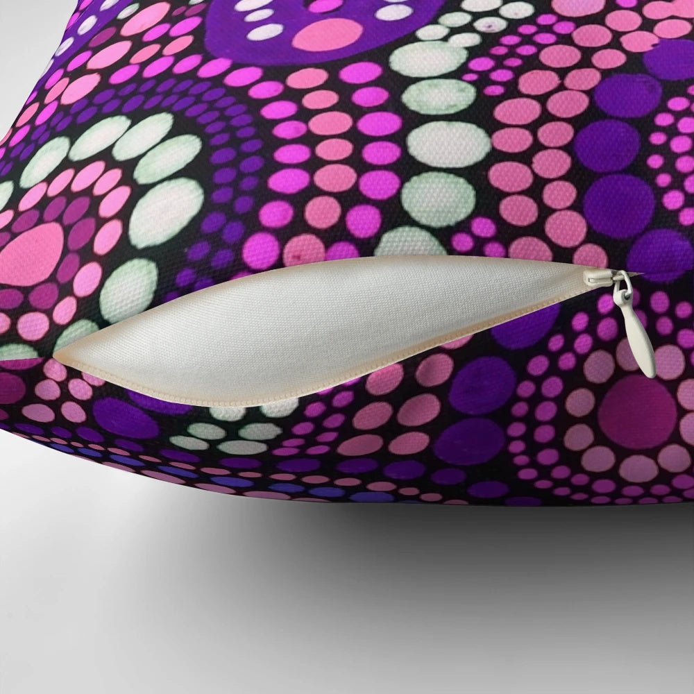 Colorful aboriginal art pattern in shades of pink adorns a plush throw pillow, perfect for creating a welcoming atmosphere in your home.
