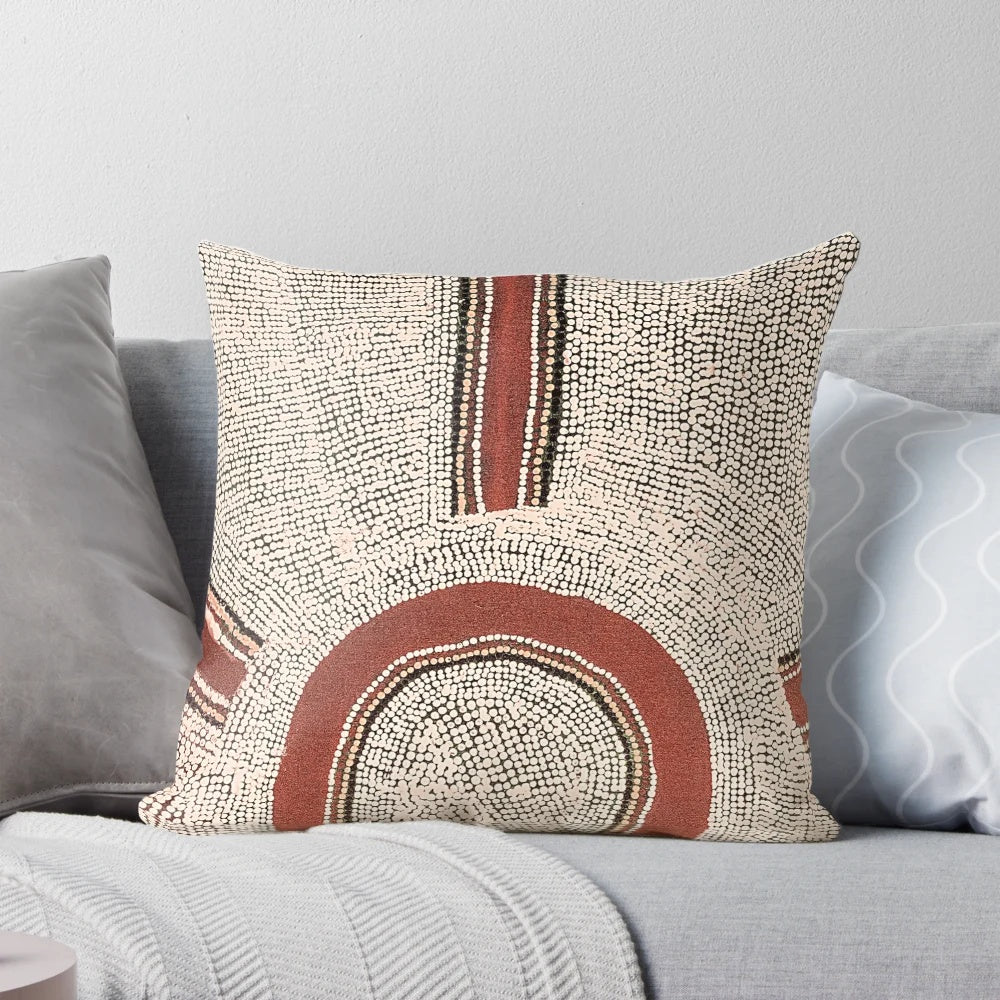 Colorful aboriginal dot art design on a throw pillow, featuring intricate patterns and circles inspired by Australian indigenous culture.