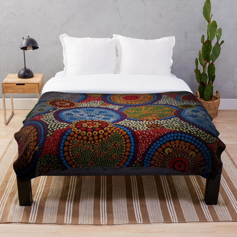 Vibrant aboriginal-inspired plush blanket with dot art design