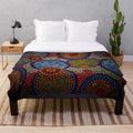 Vibrant aboriginal-inspired plush blanket with dot art design