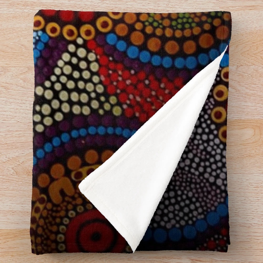 Vibrant aboriginal-inspired plush blanket with dot art design