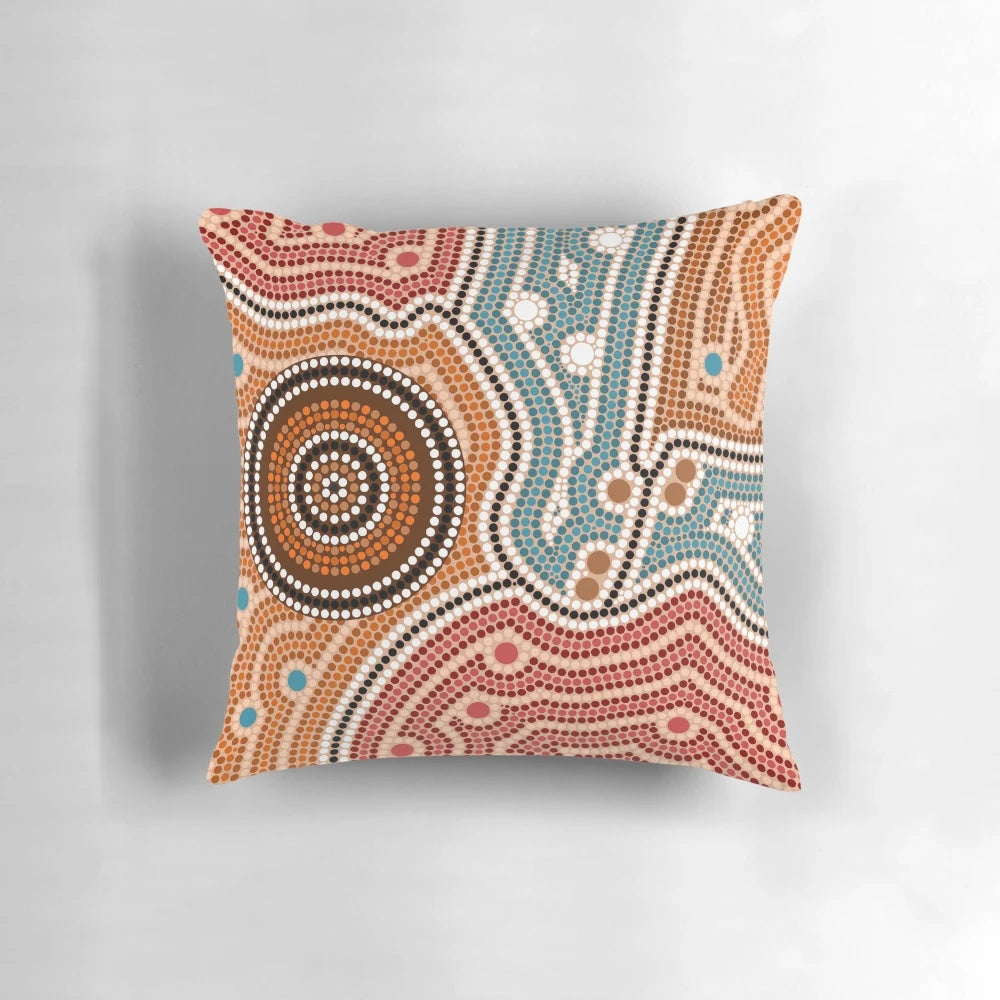 Colorful aboriginal-inspired dot painting design on a throw pillow for home decor