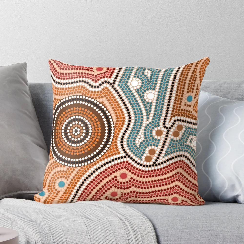 Colorful aboriginal-inspired dot painting design on a throw pillow for home decor