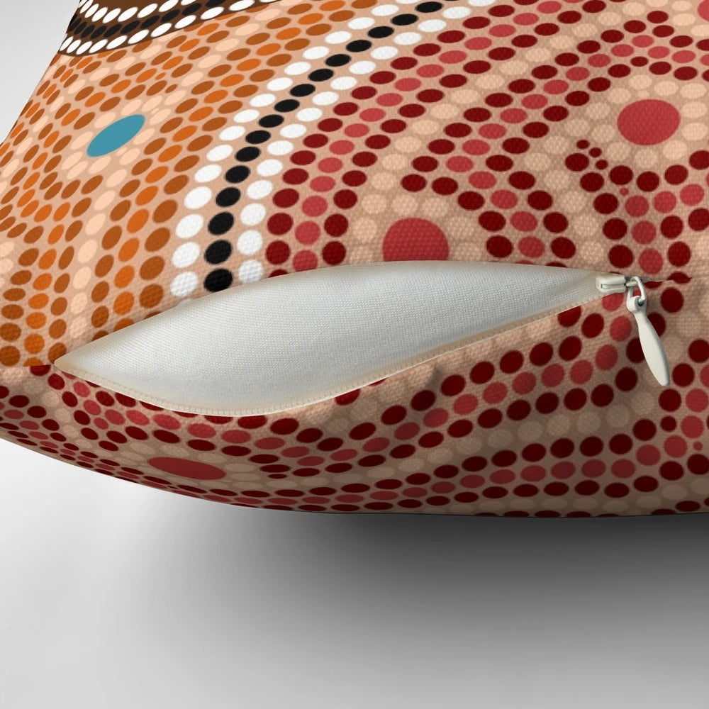 Colorful aboriginal-inspired dot painting design on a throw pillow for home decor