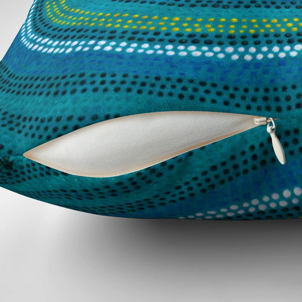 Vibrant blue pillow featuring an aboriginal-inspired waterhole design