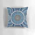 Colorful aboriginal dot painting design on a decorative throw pillow featuring an ocean theme.