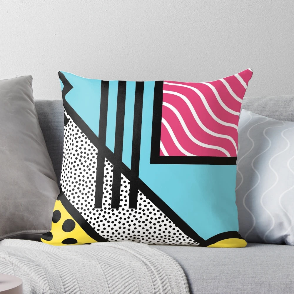 Colorful abstract 80s memphis pop art style graphics on a decorative throw pillow