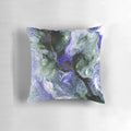 Colorful abstract fluid art decorative pillow featuring shades of purple, green, and gold.