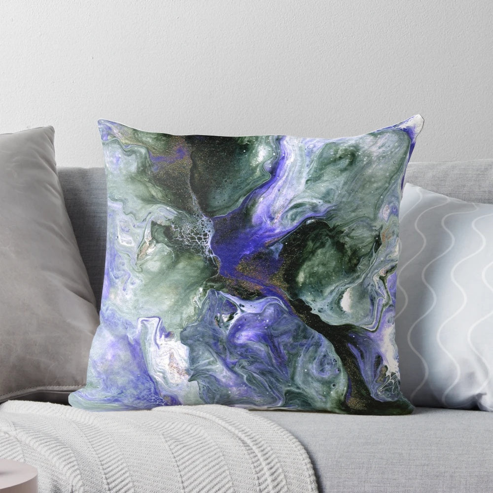 Colorful abstract fluid art decorative pillow featuring shades of purple, green, and gold.