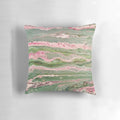 Colorful abstract art acrylic pour design on a decorative throw pillow in pink and green stripes.