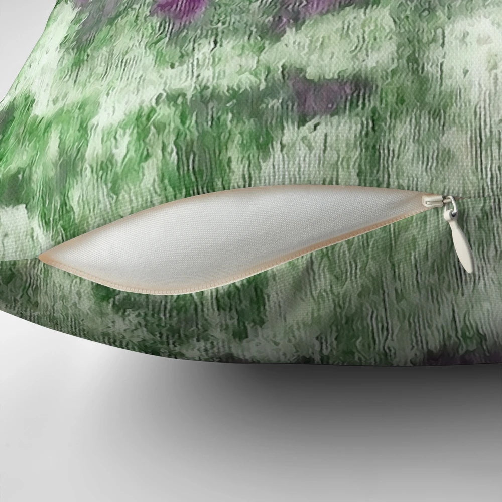 Colorful abstract art painting in purple and green tones on a modern throw pillow.