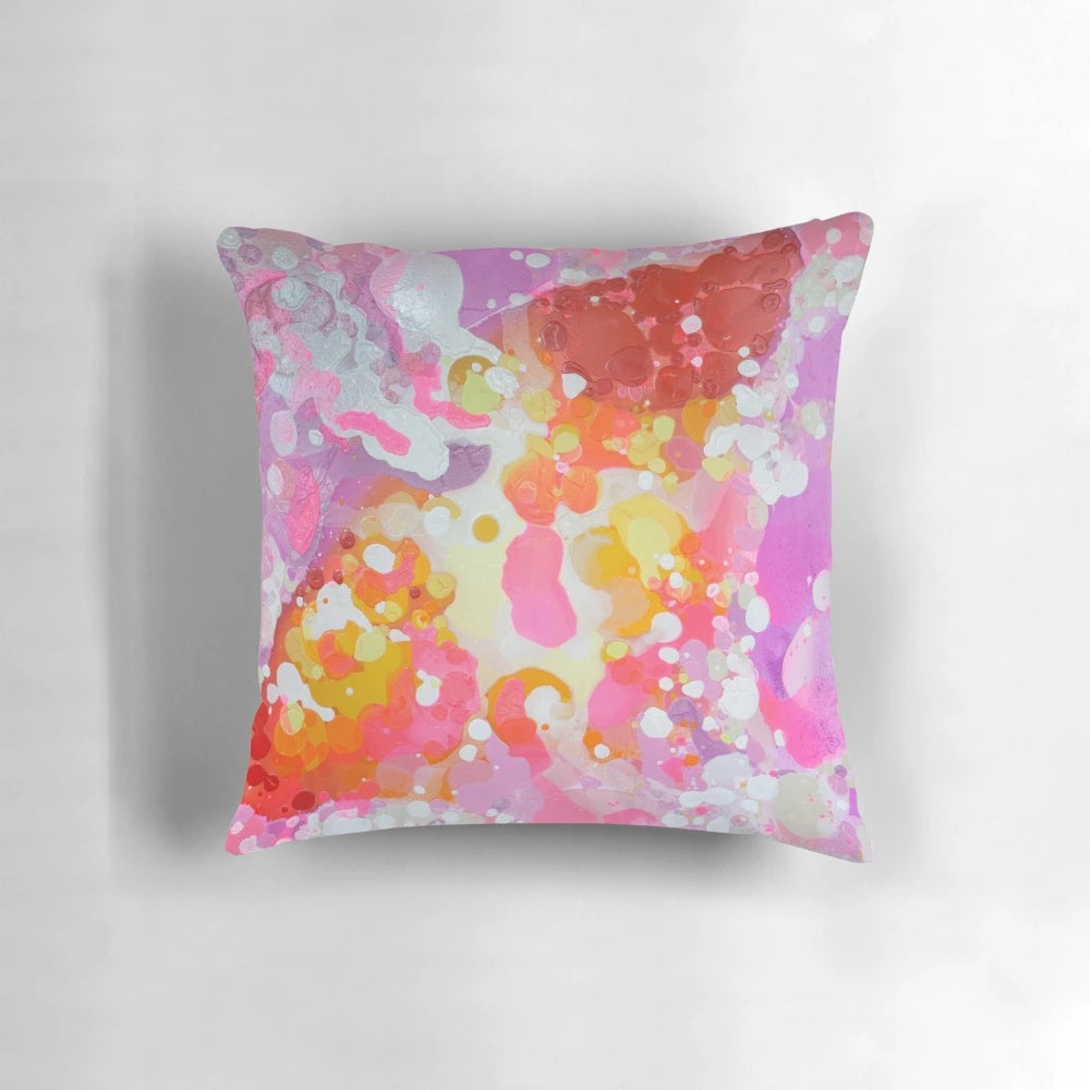 Vibrant abstract painting in pink and purple hues on a large format pillow by Canadian artist Claire Desjardins