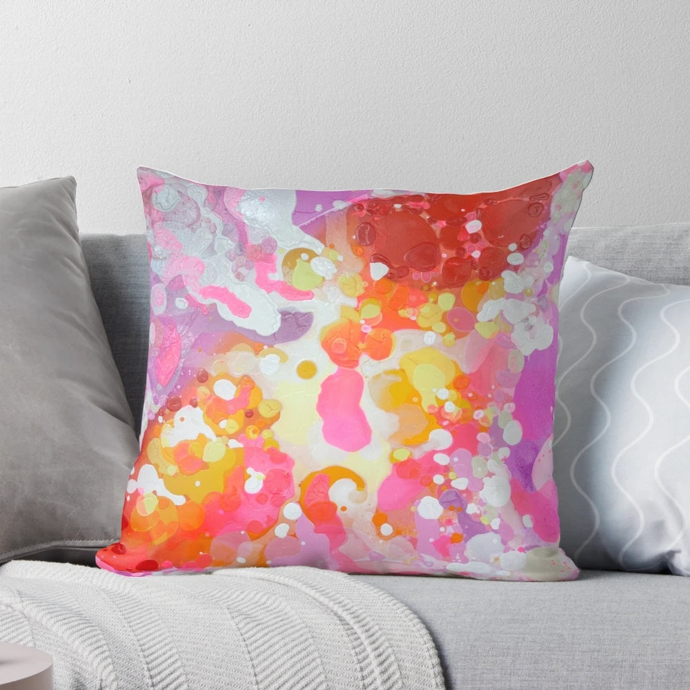 Vibrant abstract painting in pink and purple hues on a large format pillow by Canadian artist Claire Desjardins