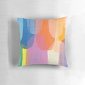 Colorful abstract art pillow featuring purple, blue, and tangerine tones designed by Canadian artist Claire Desjardins