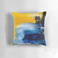Colorful abstract art pillow in blue and yellow tones