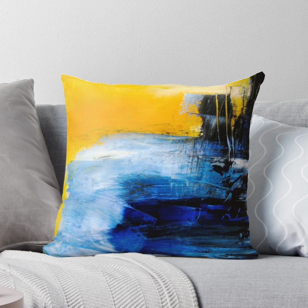 Colorful abstract art pillow in blue and yellow tones