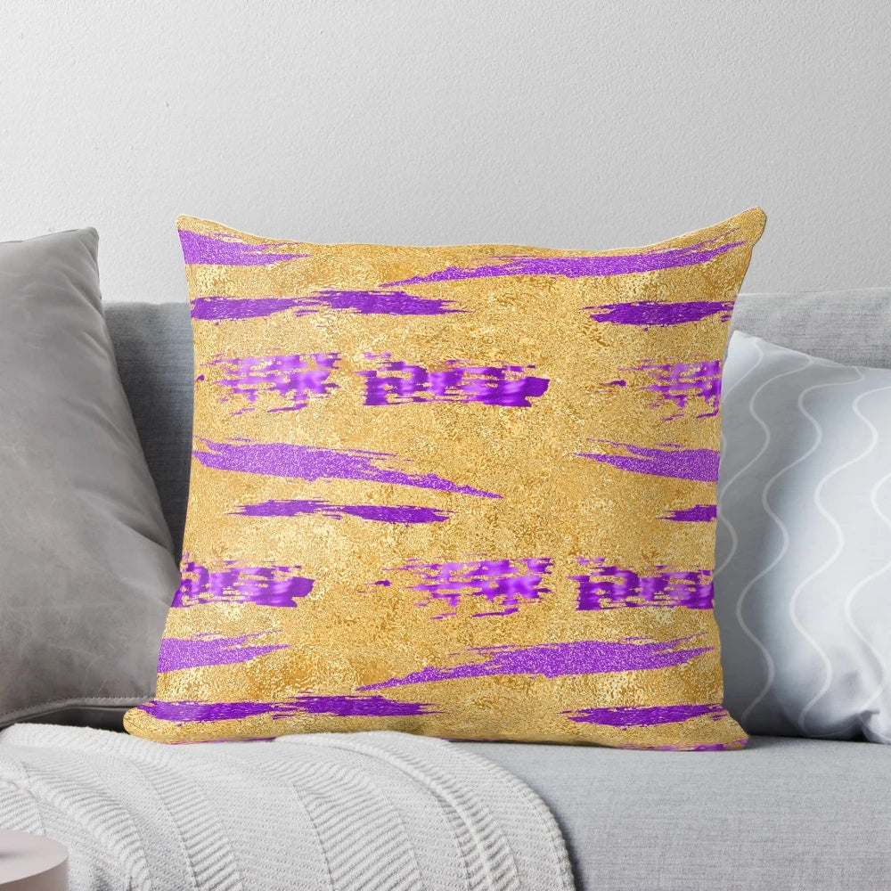 Stylish abstract art pillow in shimmering purple and gold tones, featuring a contemporary paint stroke design.