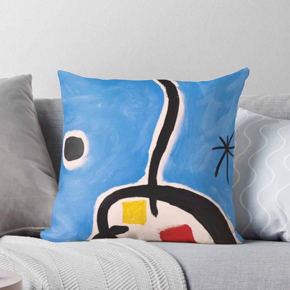 Colorful abstract pillow featuring geometric shapes and patterns reminiscent of the iconic artwork of Spanish artist Joan Miró.