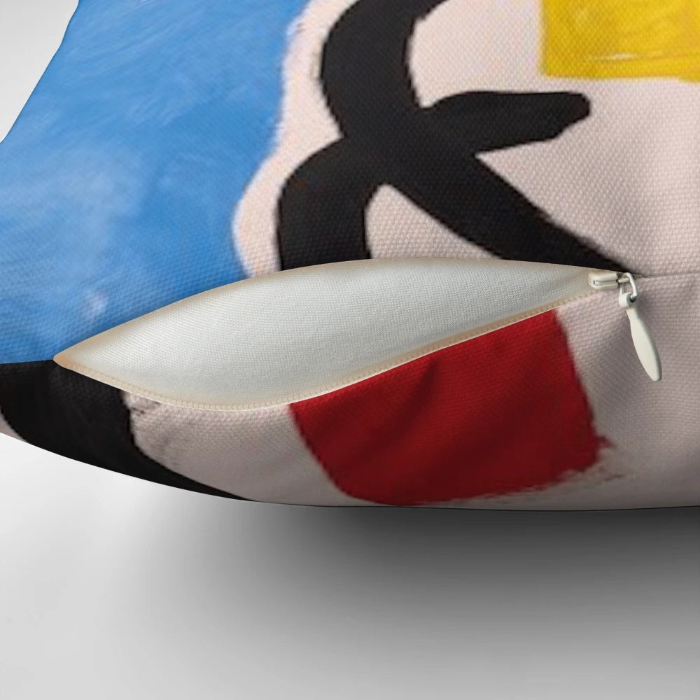Colorful abstract pillow featuring geometric shapes and patterns reminiscent of the iconic artwork of Spanish artist Joan Miró.