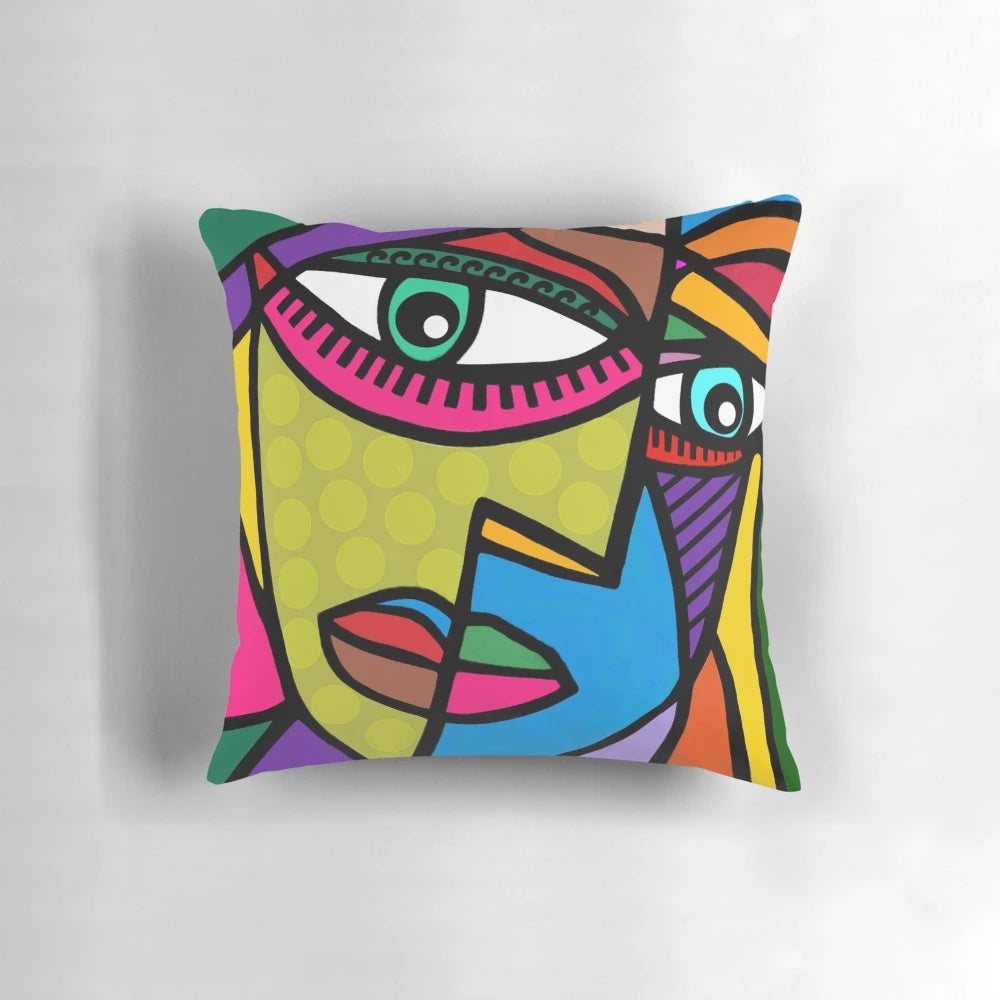 Colorful abstract art face design with dots and stripes on a throw pillow