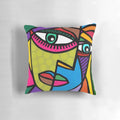 Colorful abstract art face design with dots and stripes on a throw pillow