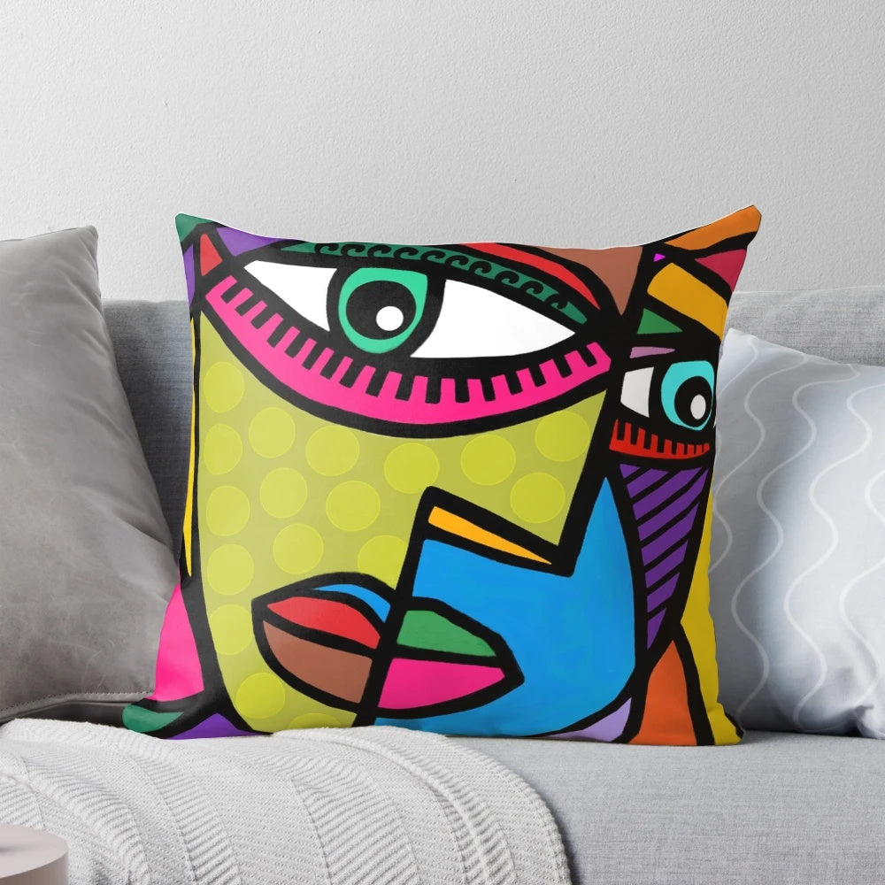 Colorful abstract art face design with dots and stripes on a throw pillow