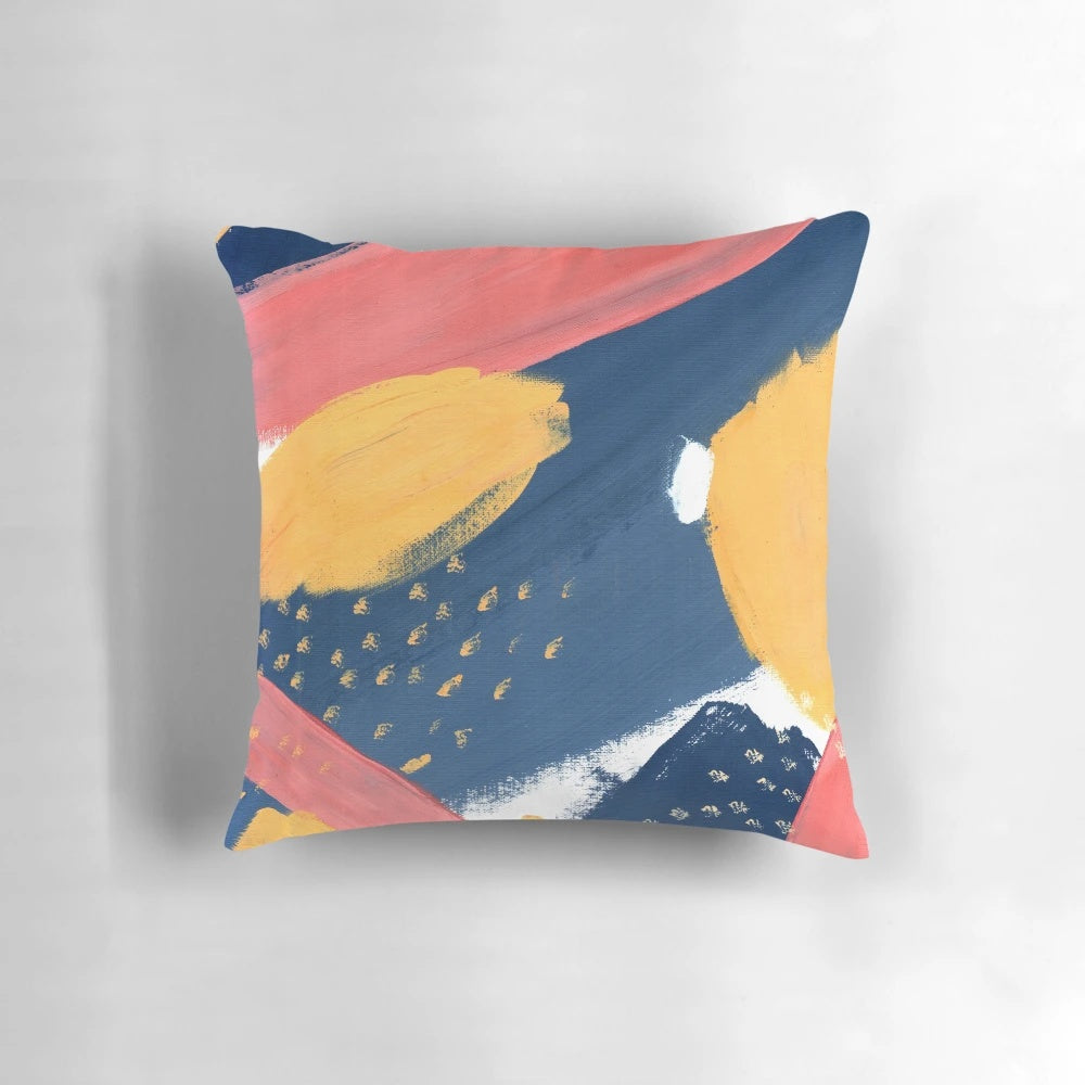 Vibrant abstract art throw pillow featuring colorful splashes of pink, yellow, and blue