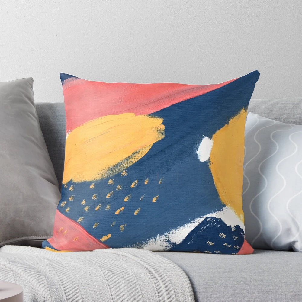 Vibrant abstract art throw pillow featuring colorful splashes of pink, yellow, and blue