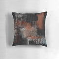 Vibrant abstract black and orange throw pillow with textured paint design, perfect for modern living room and home decor.