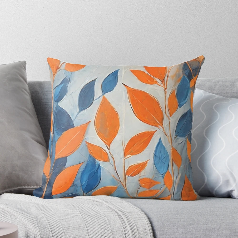 Throw pillow featuring an abstract design of blue and orange leaves
