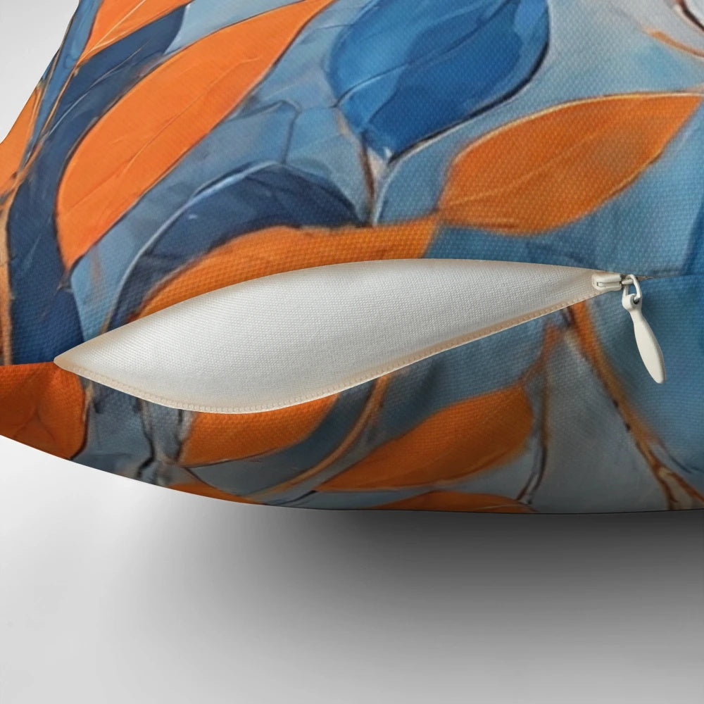 Throw pillow featuring an abstract design of blue and orange leaves