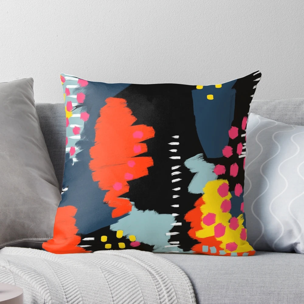 Dark abstract patterned pillow with bold, vibrant colors