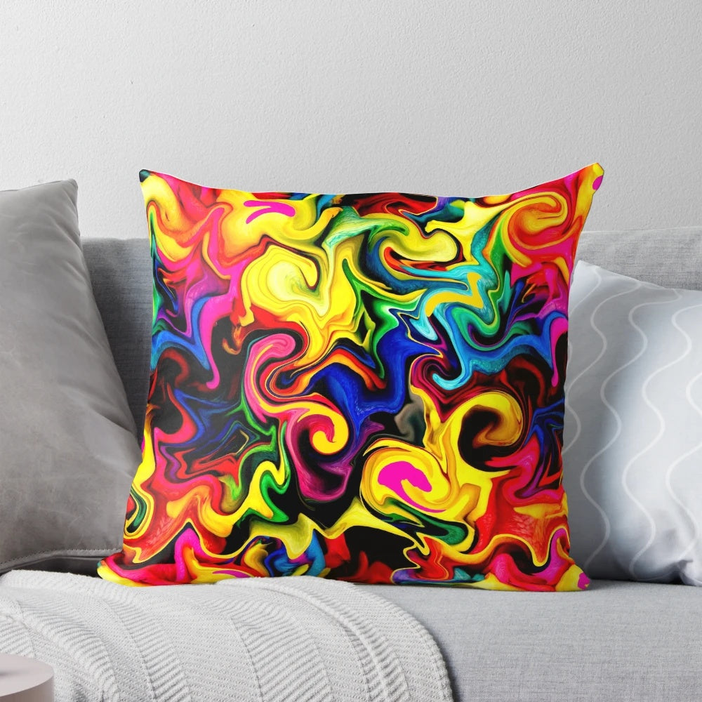 Colorful abstract designs in shades of purple, green, yellow, blue, and red on a decorative throw pillow.