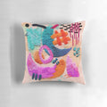 Colorful abstract embroidered pillow with geometric patterns and textured design