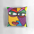 Colorful abstract art face design on a decorative throw pillow for living room or bedroom.