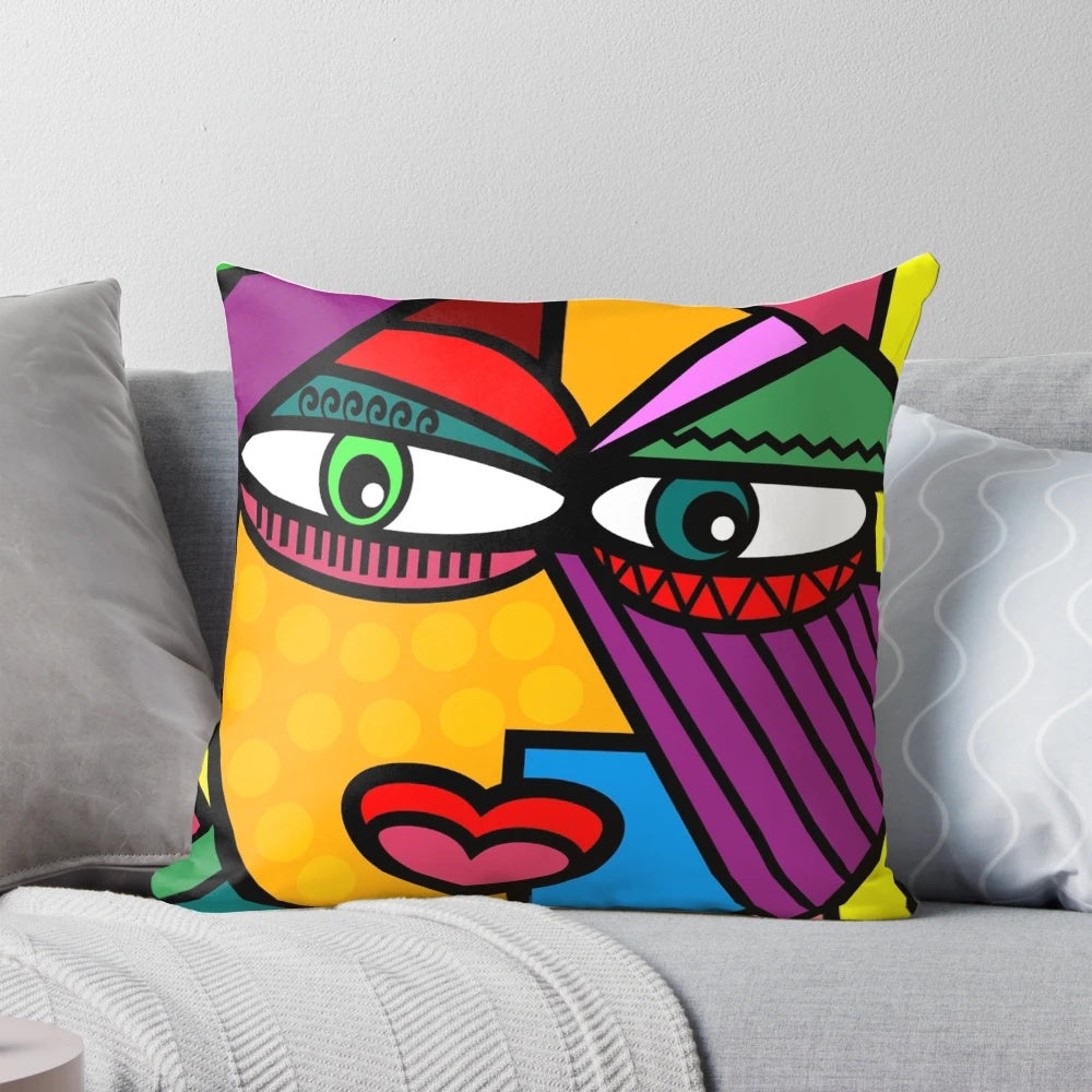 Colorful abstract art face design on a decorative throw pillow for living room or bedroom.