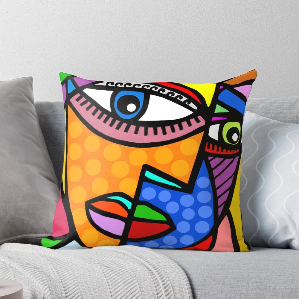 Colorful abstract art face design with dots and stripes on a decorative throw pillow