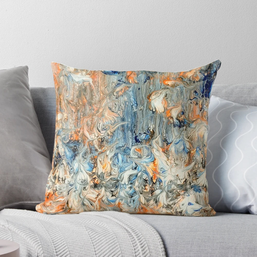 Decorative abstract floral throw pillow in complementary blue and orange colors
