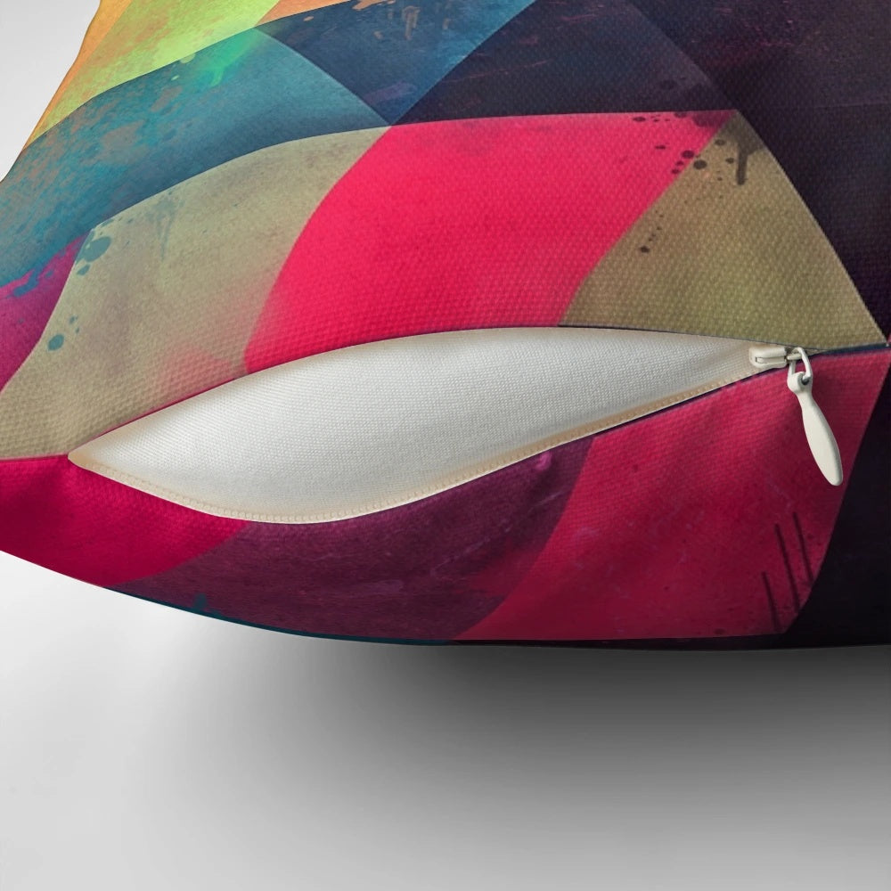 Colorful abstract geometric patterned pillow with bright neon triangles and modern textures