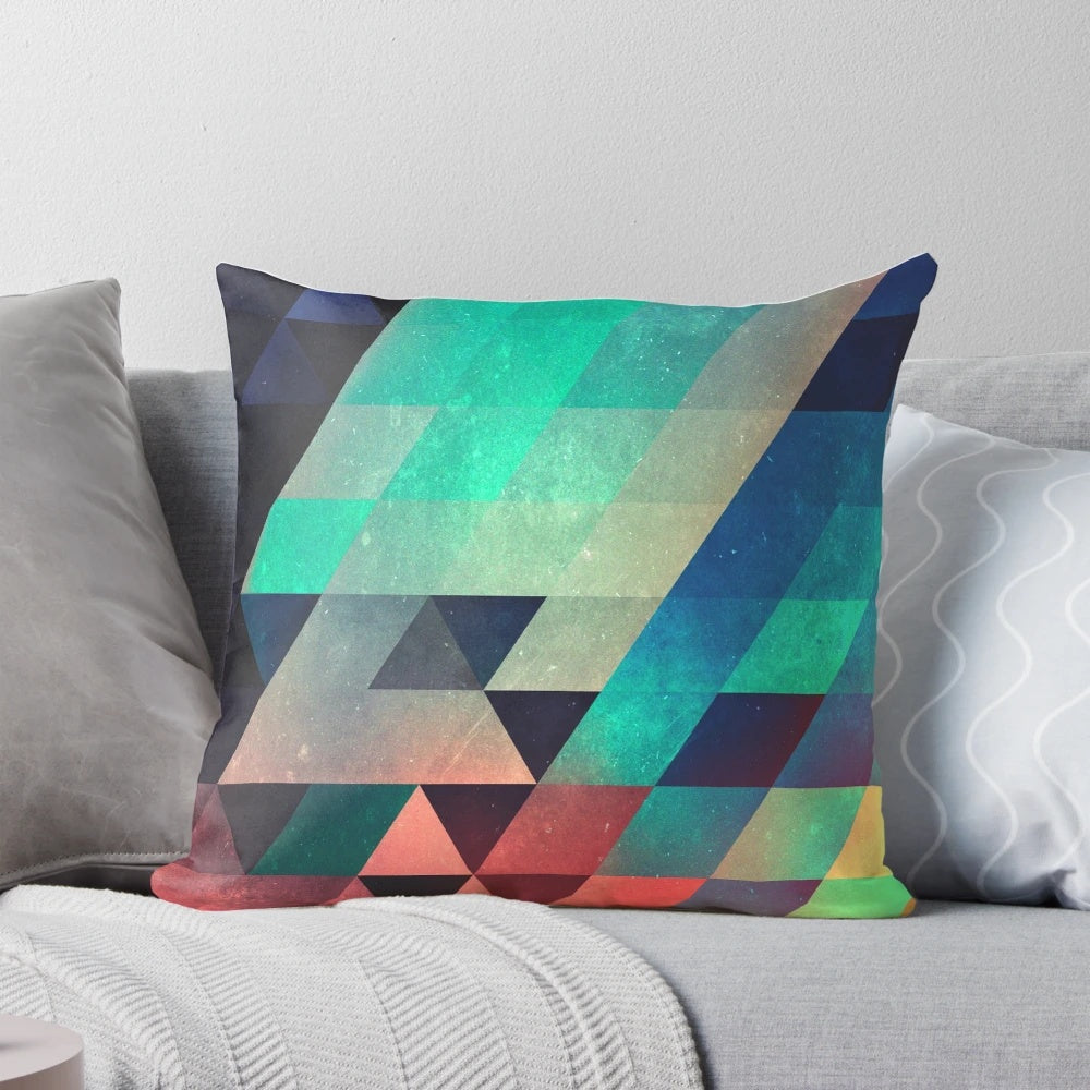 Vivid abstract geometric pillow with triangular patterns and depth