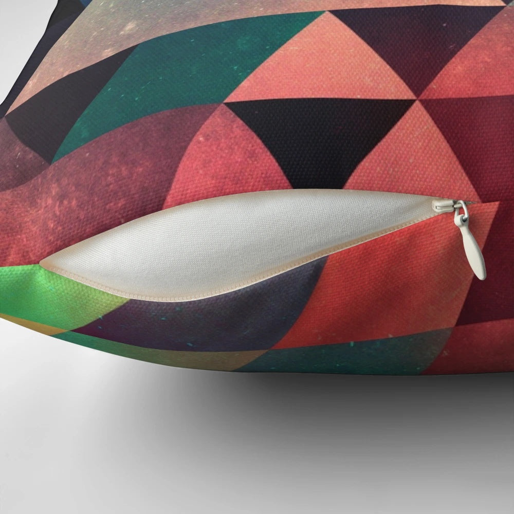 Vivid abstract geometric pillow with triangular patterns and depth