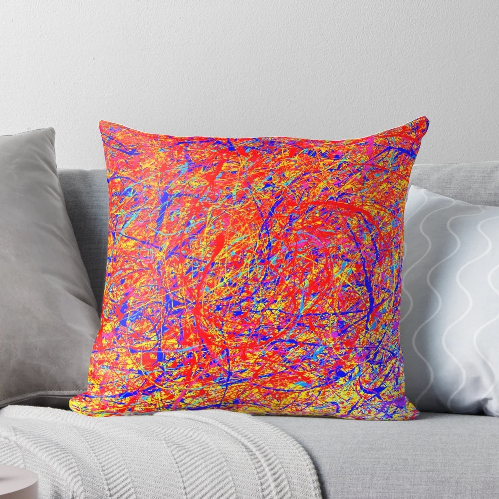 Vibrant abstract throw pillow with Jackson Pollock-inspired color splash design
