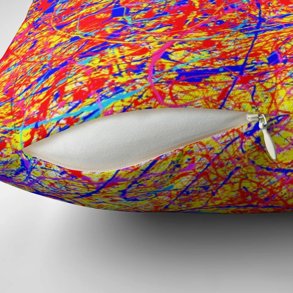 Vibrant abstract throw pillow with Jackson Pollock-inspired color splash design