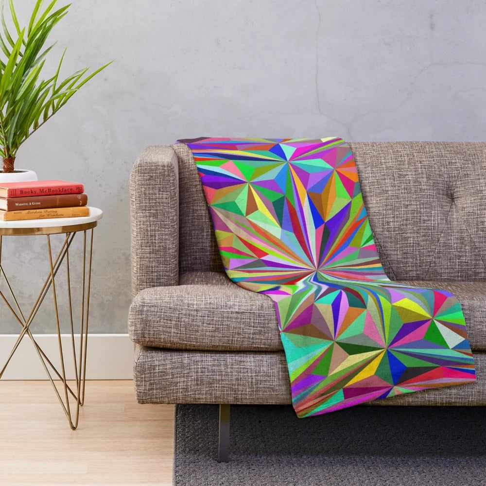 Colorful abstract kaleidoscope pattern on a cozy plush blanket