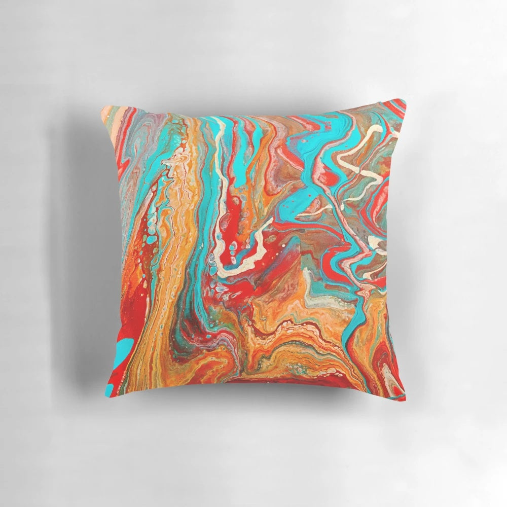Vibrant abstract paint pour design on a decorative accent pillow.