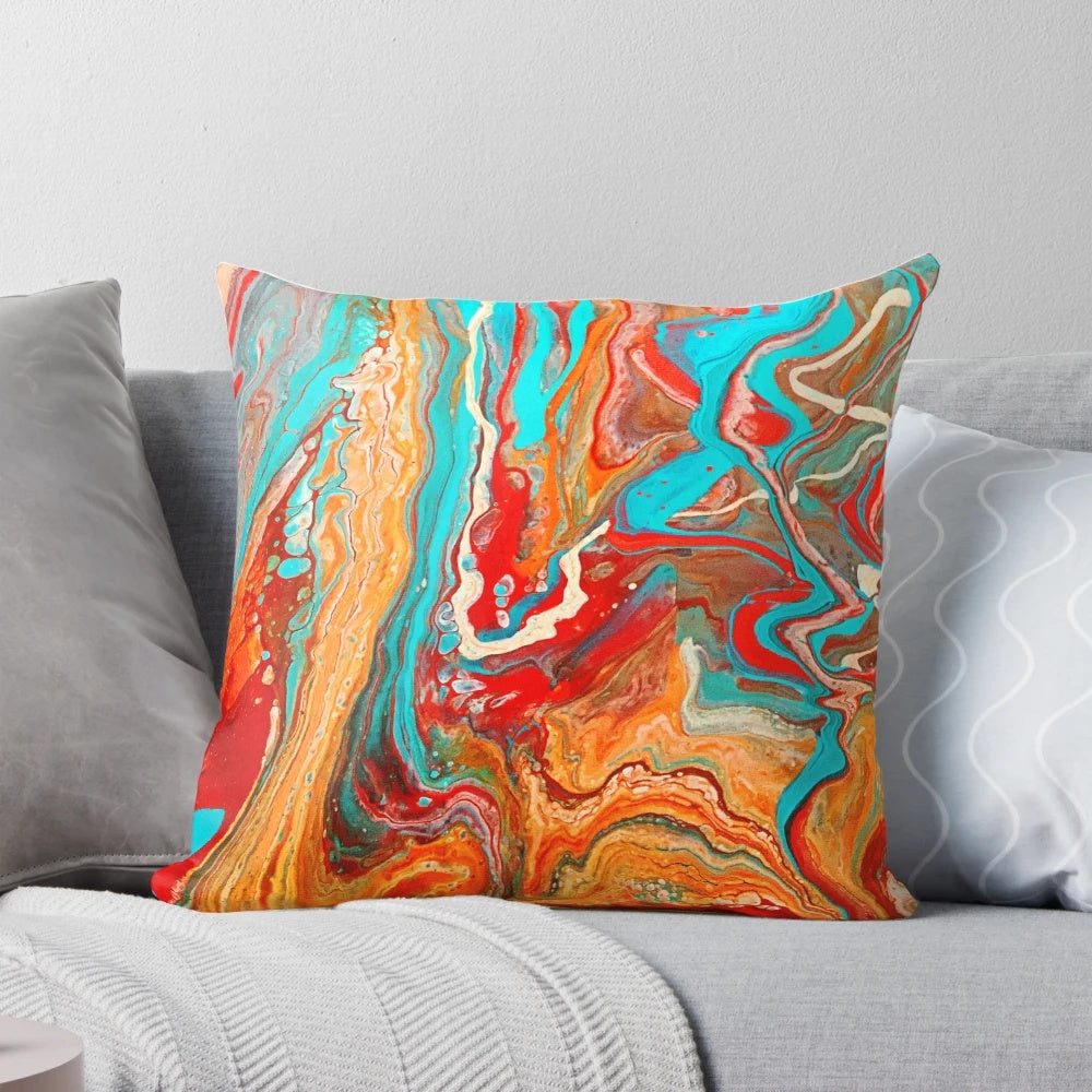 Vibrant abstract paint pour design on a decorative accent pillow.
