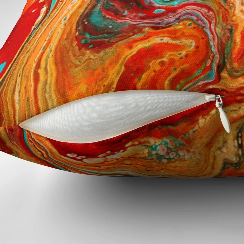 Vibrant abstract paint pour design on a decorative accent pillow.