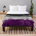 Plush blanket featuring an abstract paint splatter design in the colors of the asexual pride flag
