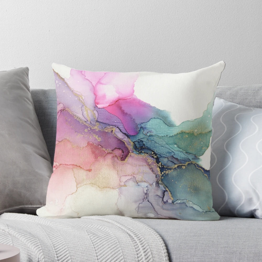 Colorful abstract painting on a canvas pillow with fluid, textured patterns in shades of turquoise, pink, coral, and violet.
